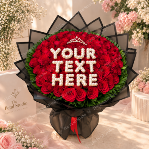 100 Red Rose Customizable Text Bouquet - 100 red rose bouquet with customizable pearl text, green foliage, black wrapping and red ribbon