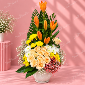 Orange Lily Mixed Flower Arrangement - Orange lilies, yellow chrysanthemums, peach roses and white daisies in a basket arrangement