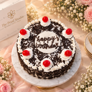 Black Forest Birthday Cake - Black Forest birthday cake with chocolate shavings, whipped cream and red cherries