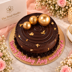 Chocolate Birthday Cake with Gold Balls - Chocolate birthday cake with gold balls, gold leaf and pink Happy Birthday lettering