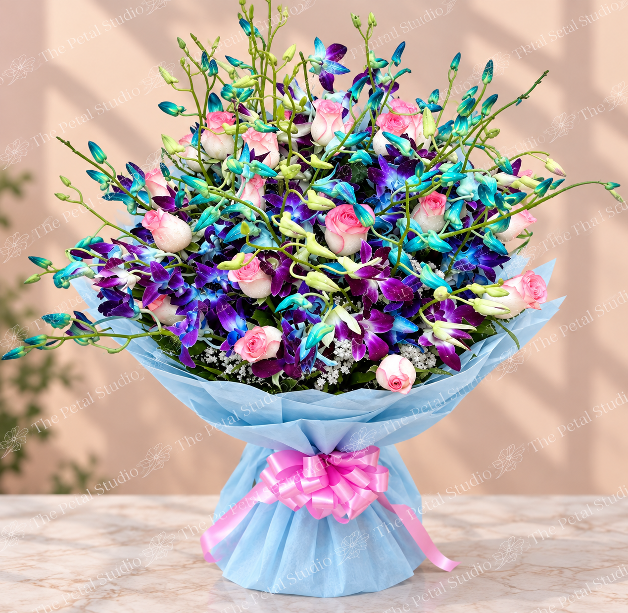 Blue and Purple Mixed Rose Orchid Bouquet - Mixed bouquet of pink roses and vibrant blue and purple orchids with blue wrapping and pink ribbon