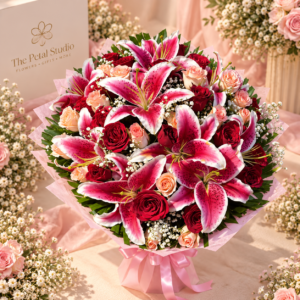 Pink Lily Red Rose Premium Bouquet - Pink lily and red rose premium bouquet with peach roses, baby's breath and pink wrapping